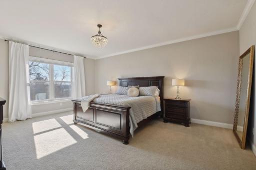 Escape to the primary suite, with amenities and features you would expect, spacious his and her closet spaces.