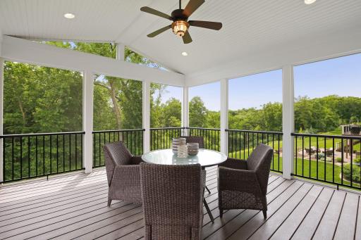 Gorgeous three season porch, with tranquil views overlooking the bluff. The perfect place to relax.