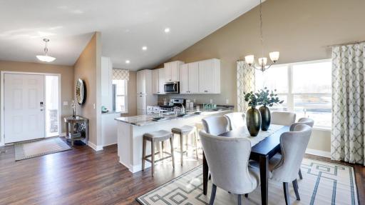 Open concept living at it's best with the vaulted main level ceilings! Photos of model home. Colors and options may vary. Ask Sales Agent for details.