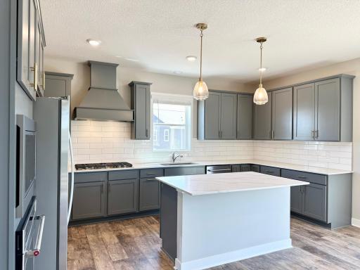 Representation of finishes with the gourmet kitchen. *Photos of a similar home. Colors and options may vary.