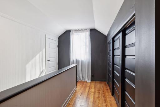 Beautifully refinished hardwood floors upstairs really work well with the black and white color scheme