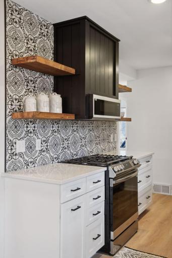Check out the detail in the tile work and those wood accents again of your floating shelves