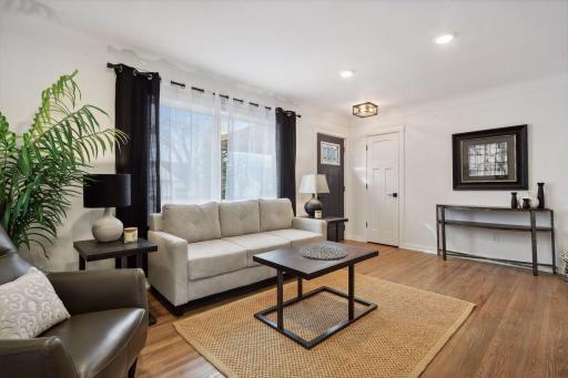 Huge, new front window floods the space with natural light