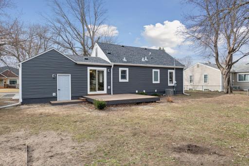 New vinyl siding wraps the sides and rear of the home while wood board and batten style siding adorns the front