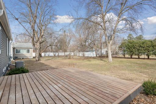 New deck boards on your sizable deck overlooking the backyard on your nearly quarter acre lot