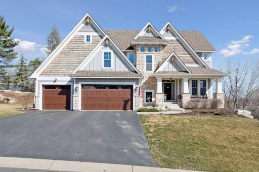 Exceptional Gonyea-built two-story home! Tudor-inspired stone & shake front facade.