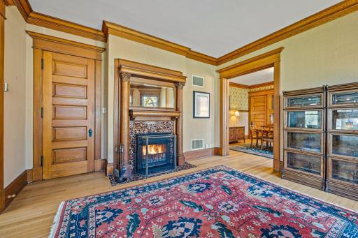 The Family Room with converted wood-burning fireplace blends historic charm with modern comfort.