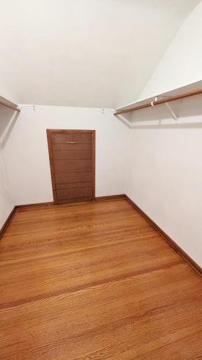 One of the upstairs bedrooms features a walk-in closet