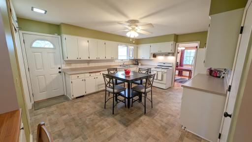 Huge kitchen with access to the backyard, plenty of cupboard space and room for a large eat-in area