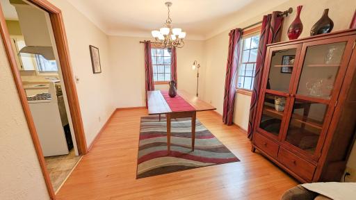 Formal dining room with beautiful hardwood floors and loads of natural light