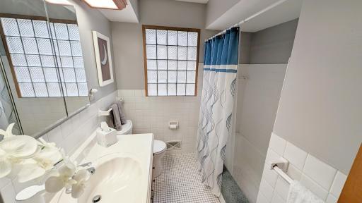 The main level full bathroom is clean and classic - just needs your decorating ideas!
