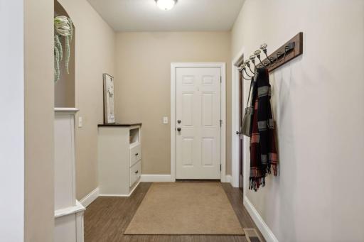 Entry from the 3-car garage - ample walk-in closet to the right