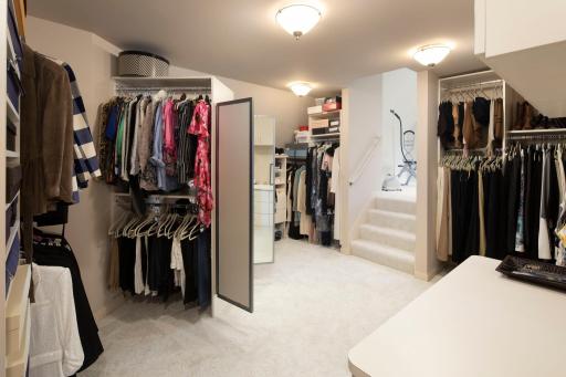 Organize your wardrobe in the enormous walk-in closet, offering ample space for all your clothing and accessories. Adjacent to the bathroom, you'll find two generous walk-in closets, providing ample storage space for your wardrobe and accessories.