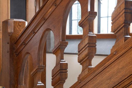 Notice the stunning architectural features of the stairway that enhance the home's grandeur.
