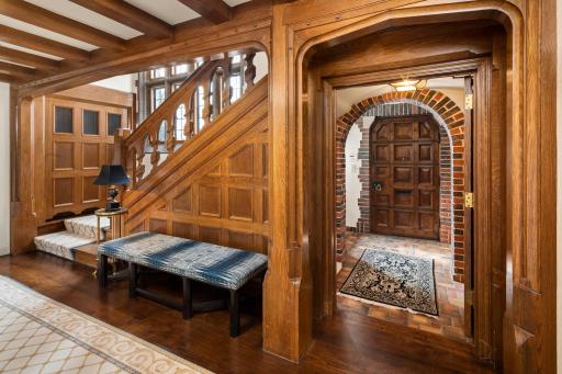 Refined elegance and timeless charm begin in the entryway of this stunning home. Admire all of the intricate original woodwork and hardwood floors in immaculate condition throughout.