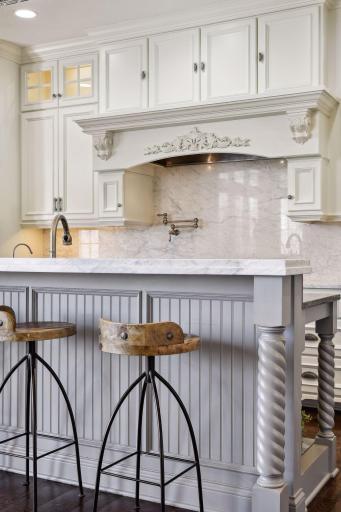 Impressive rope moulding and millwork on the center island as well as other cabinetry through home.