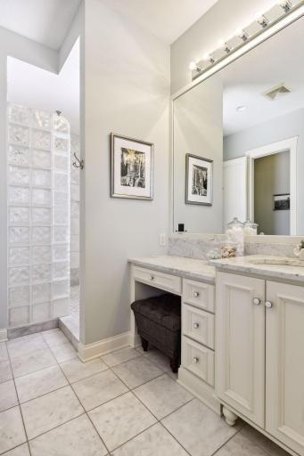 Getting ready area with large, custom walk-in shower offering 3 shower heads & 2 jets.