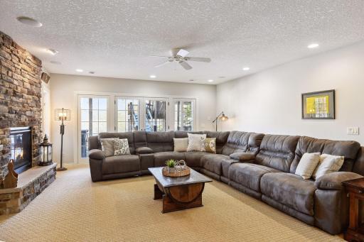 Lower level walks out to the private backyard with stamped concrete patio and hot tub! Surround sound system to enjoy every sport game or movie night.