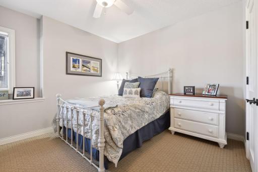 Lower level ensuite bedroom with double door, extra deep closet, and 2 corner windows.
