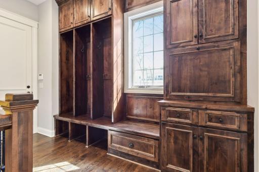 Floor to ceiling Alderwood built-ins and cubbies in the mud room off the garage.