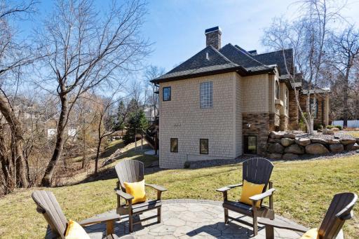Stamped concrete firepit with views of this spectacular lot on over an acre!
