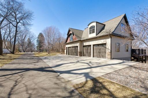 Fantastic, desirable 4 car garage insulated with heater, epoxy floors, and drain. Additional parking available on the concrete driveway.