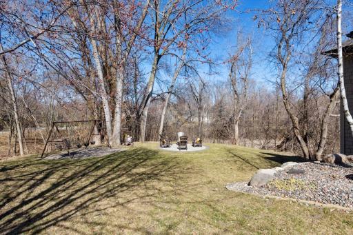 Serene yard and firepit area! Perfect for summer nights outside.