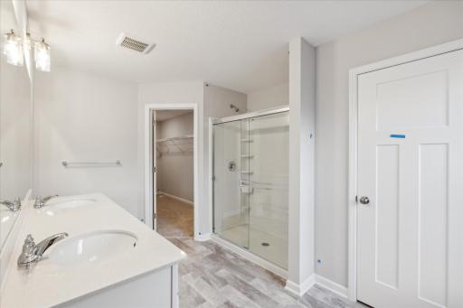 Owners Bathroom with linen closet. Similar floorplan but different finishes.