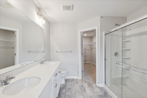 Photo for 6630 Wildflower Way, Minnetrista, MN 55331 - Listing #6505632 Owners bath with double vanity. Similar floorplan but different finishes.