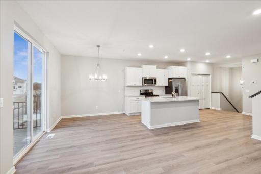 Dining and gourmet kitchen. Similar floorplan but different finishes.