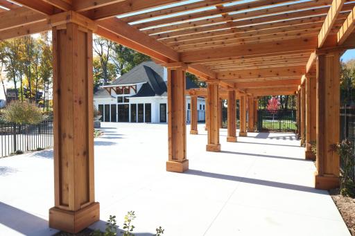 Pergola at a pool plus views of the clubhouse