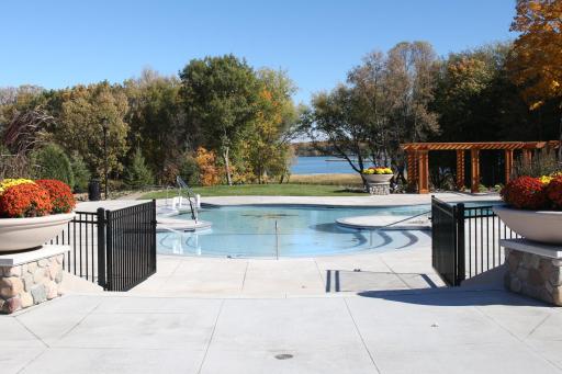 Views of Lake Minnetonka through trees at one of the two pools