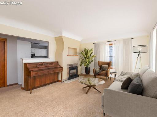Welcome family & friends into this charming home's sun-drenched living room with characteristic coved ceiling. Virtually Staged.
