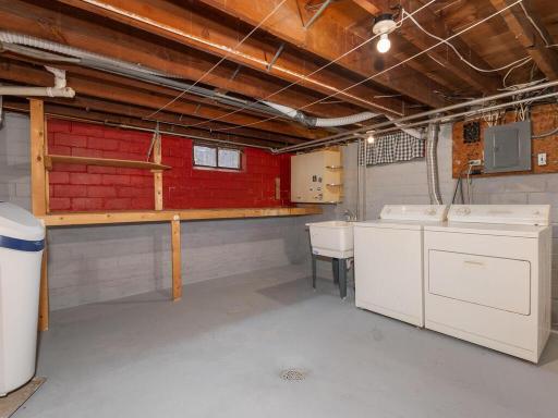 The laundry area and large storage area in the lower level offers fantastic space.