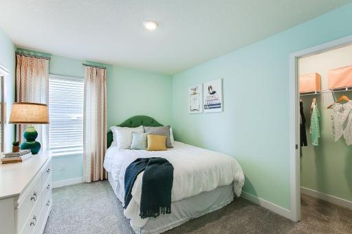 One of 3 upper-level bedrooms. Photos of model home. Colors and options may vary. Ask Sales Agent for details.