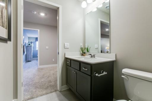 The completed lower level features a third bathroom as well as fourth bedroom! Photos of model home. Colors and options may vary. Ask Sales Agent for details.