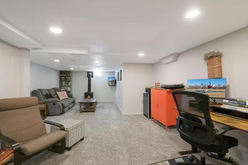 Cozy up next to the free standing gas fireplace on a cold Minnesota night.
