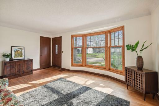 Spacious living room with beautiful front bay window.