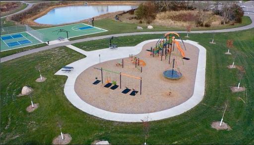 New city park adjacent from pool includes a play ground, picnic area, baseball court, and walking trails.