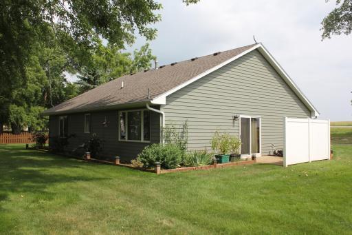 Privacy fence provides some shade on the south facing patio.