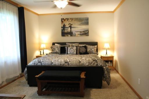 Spacious primary suite has a large westward facing window, private 3/4 bath, and a walk-in closet!