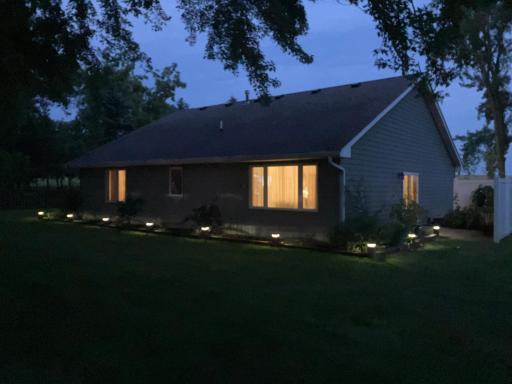 New solar landscape lighting in the flowerbeds automatically turn on at dusk.