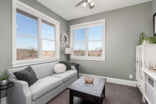 This cozy den/sitting area is just off of the kitchen area and could be used for overflow seating for large gatherings or just enjoying quite time.