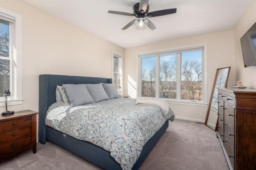 The primary bedroom is one of 3 bedrooms on the main level. Tons of windows to let in the sunlight and enjoy the outdoor scenery. The bedroom also has a private ensuite and walk in closet.