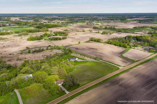 Another aerial view of the amazing acreage! Just think of all the possibilities with all this space......create your own hobby farm with pasture areas, build a barn or horse arena, plus room to roam!!