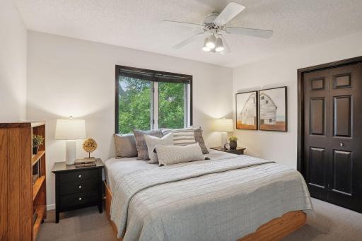 This jr suite with hidden storage behind bookcase is one of three supporting bedrooms on the upper level