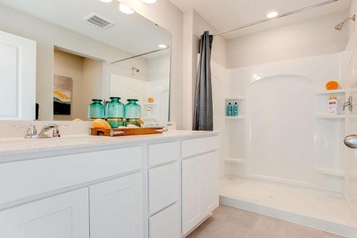 Double bowl vanity and walk-in shower are two of the amazing features of the ensuite bath. *Picture is of a model home. Actual finishes may vary.