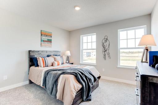 The upper level also has two other secondary bedrooms available. *Photos are of model home. Actual finishes may vary.