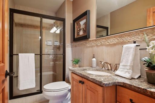 The main floor boasts this 3/4 bath with glassed in shower