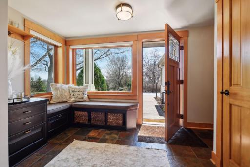 Come on in to the spacious foyer with slate flooring and ample natural light